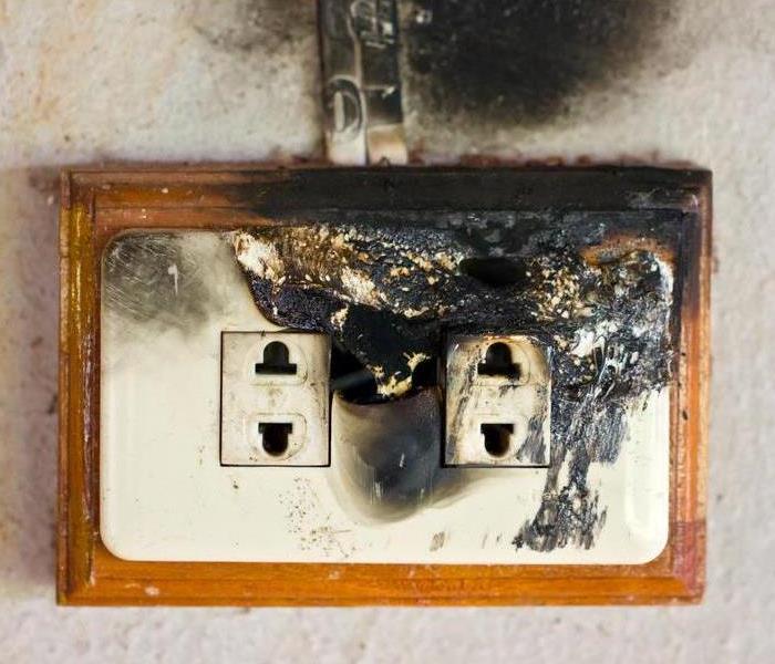 A fire damaged electrical outlet.